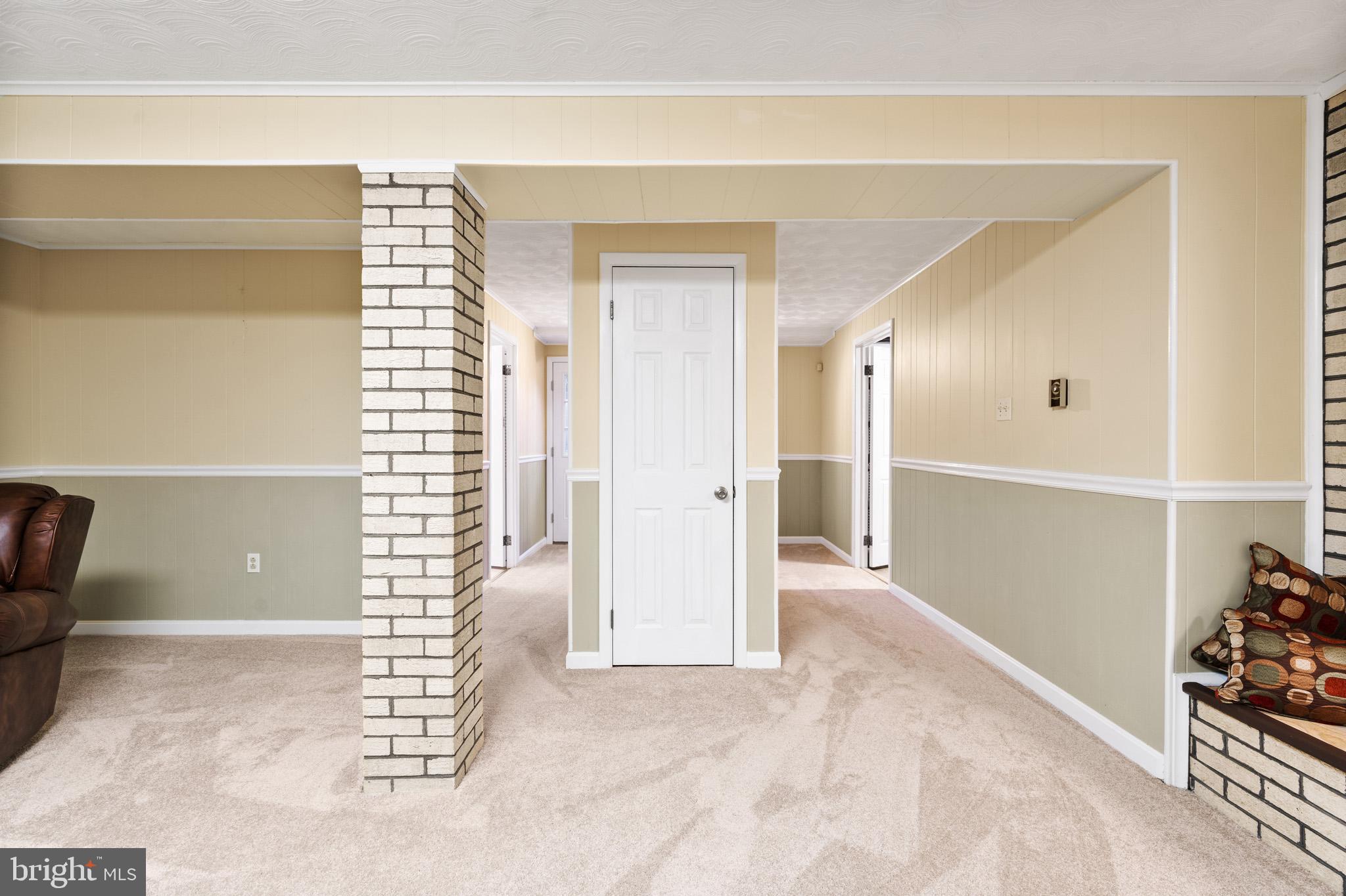 6159 Solomons Island Road Tracys Landing, MD 20779 - Photo 36 of 65 an empty room with wooden floor and windows