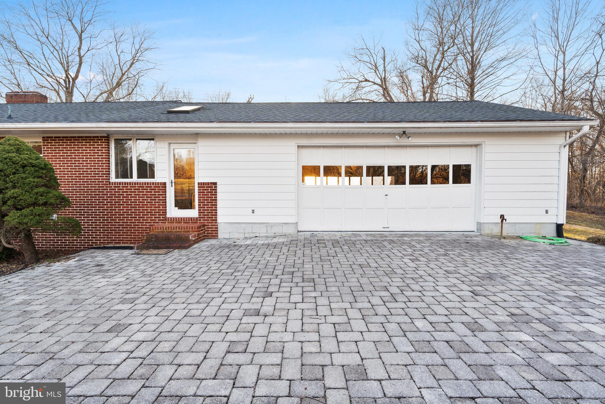 6159 Solomons Island Road Tracys Landing, MD 20779 - Photo 48 of 65 a front view of a house with a yard