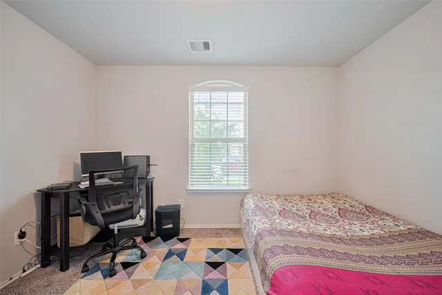 a bedroom with furniture and a bed