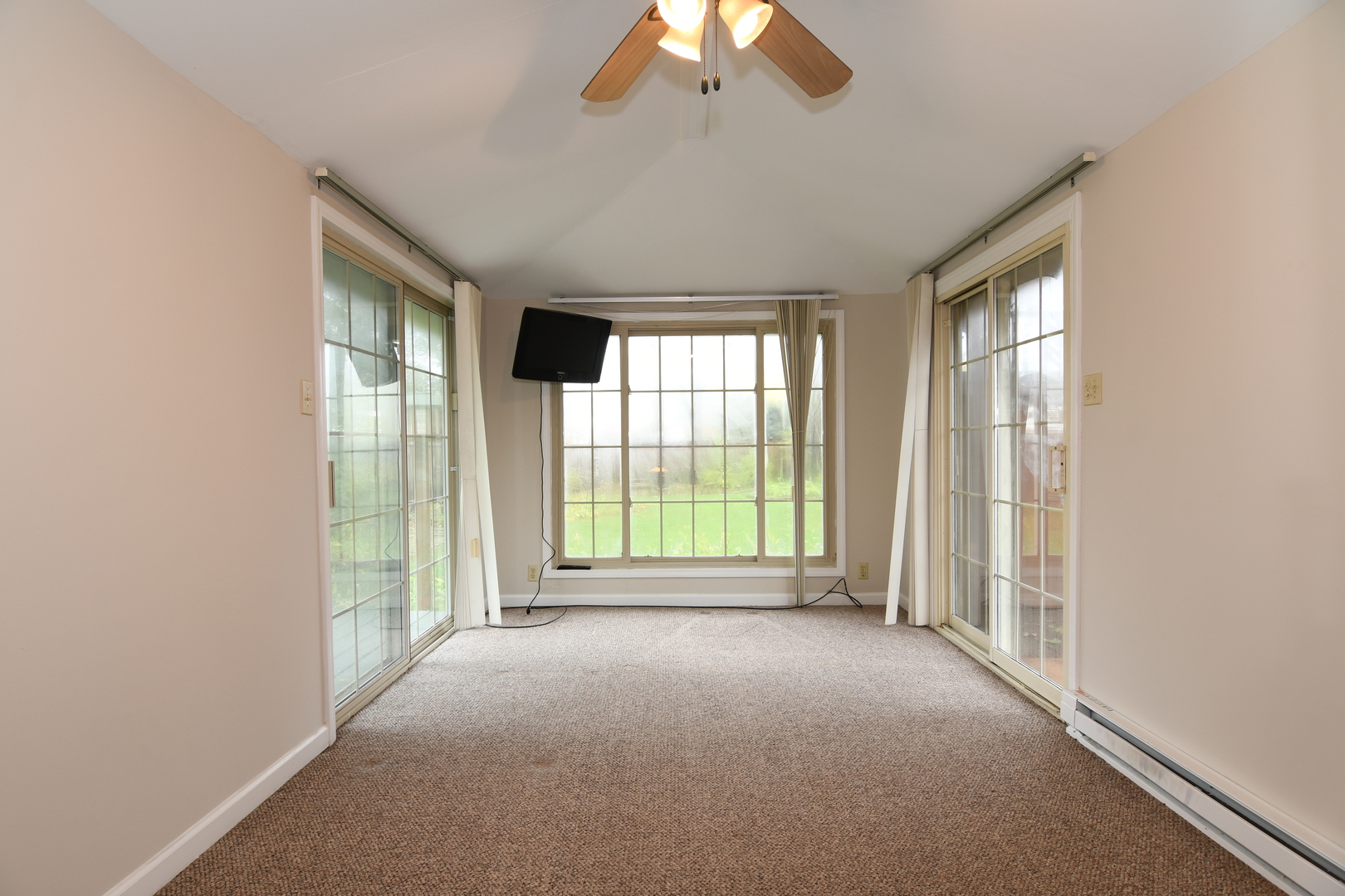 909 Warrenville Road Wheaton, IL 60189 - Photo 15 of 22 a view of an empty room with a window