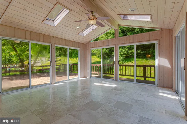 a view of an empty room with a balcony