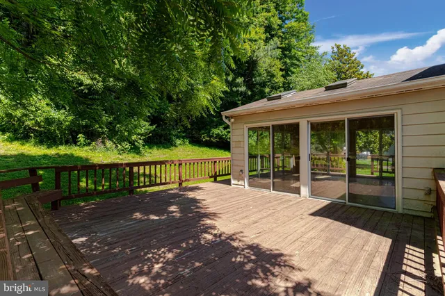 a view of a house with backyard and porch