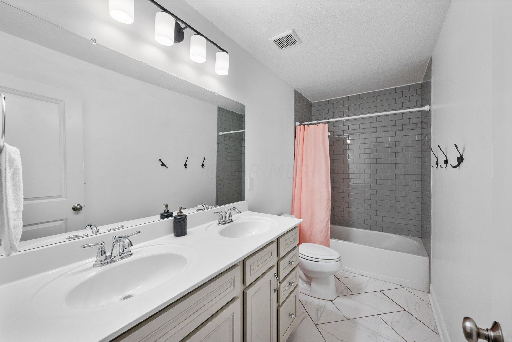 706 Bigham Ridge Boulevard Westerville, OH 43081 - Photo 41 of 62 Full hall bath with double sink vanity - fresh and spa like