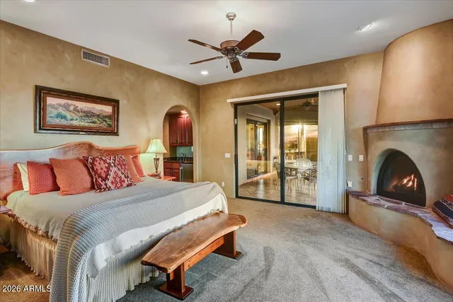 a bed room with a bed and a fireplace