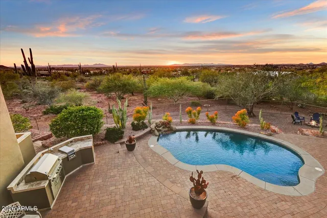 a view of a swimming pool with lounge chair
