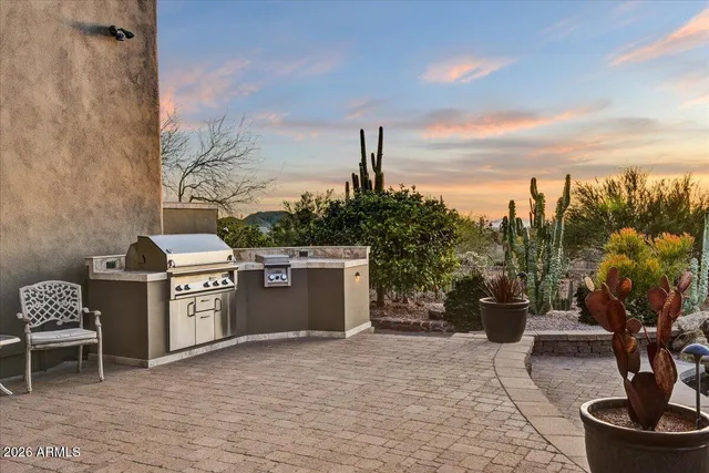 a kitchen with a stove and a chair