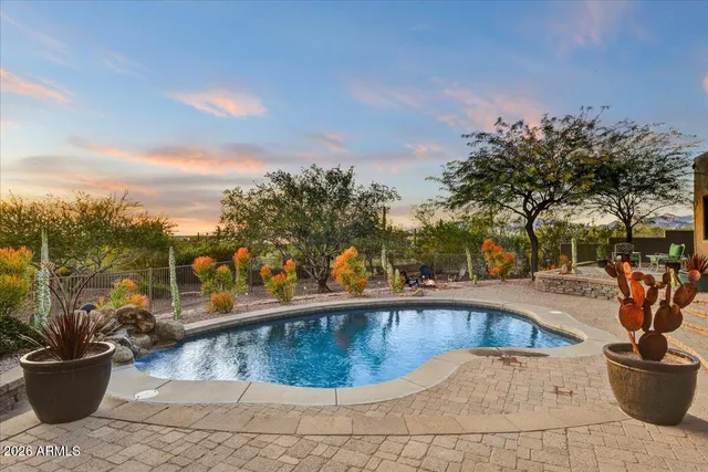 a view of a swimming pool with a lounge chair
