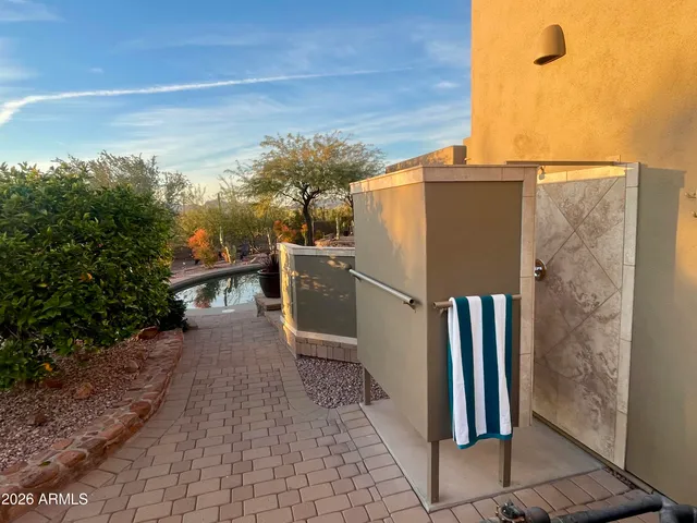 a view of a house with backyard porch and sitting area