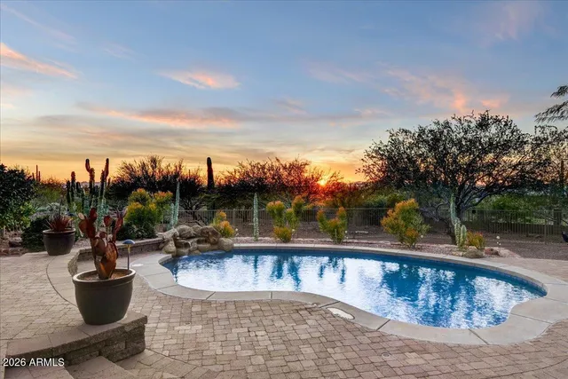a view of a swimming pool with a patio