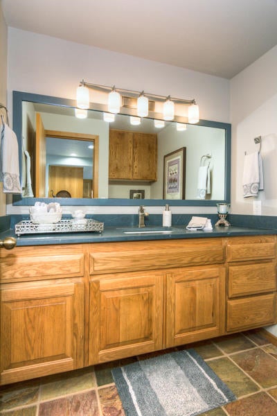 17691 Bittern Lane Sunriver, OR 97707 - Photo 9 of 18 The downstairs half bath is over-sized and sits just off of the entry and the living area.