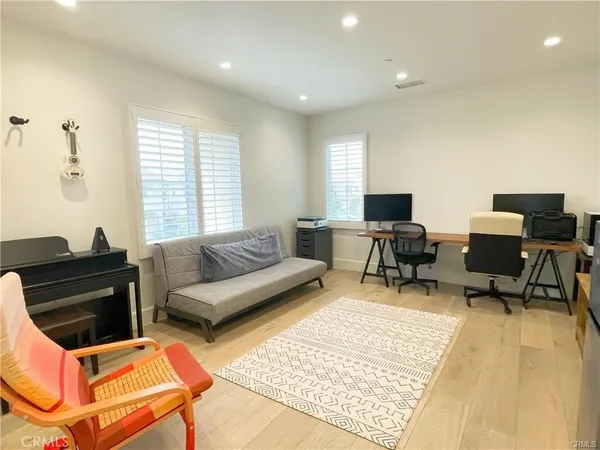 a living room with furniture rug and a window