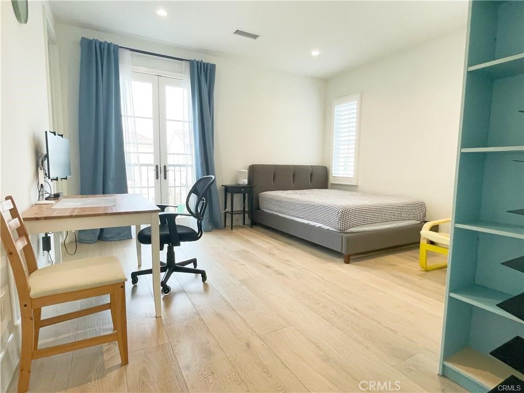 120 Statura Irvine, CA 92602 - Photo 14 of 27 a bedroom with furniture and a large window