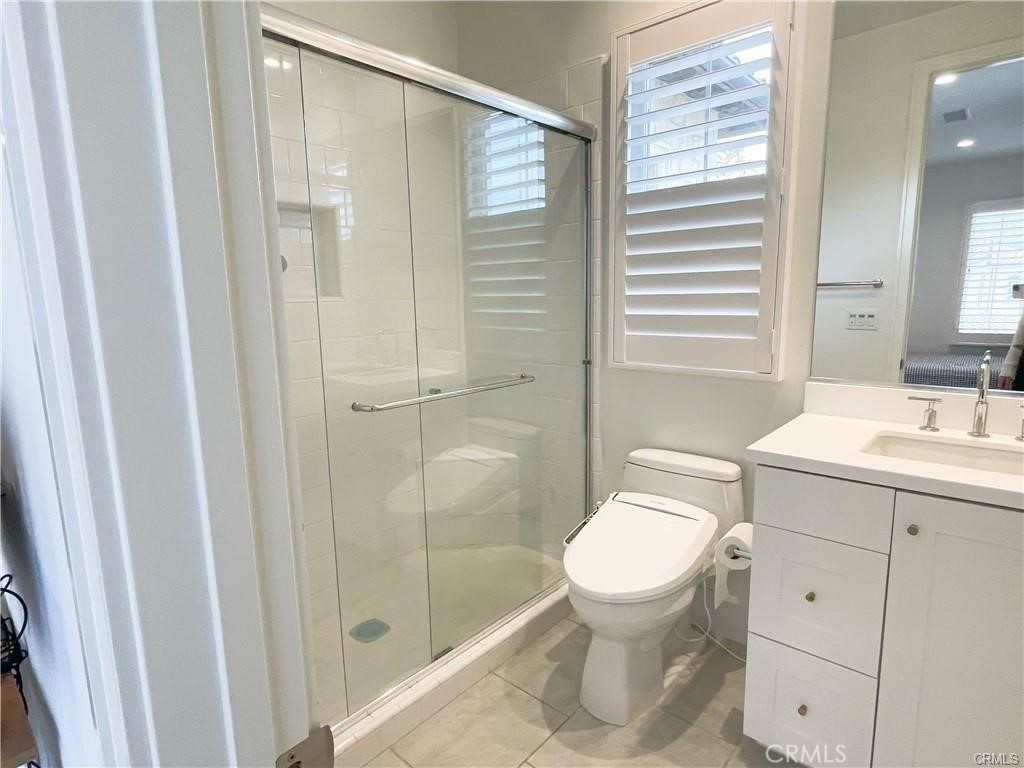 120 Statura Irvine, CA 92602 - Photo 15 of 27 a bathroom with a sink a toilet and shower
