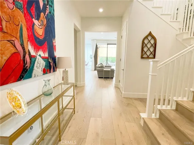 a view of a living room and bathroom with furniture