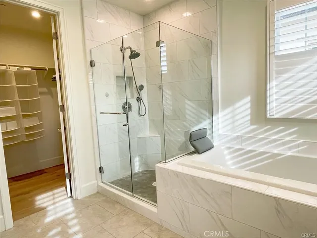 a bathroom with a bathtub and a shower
