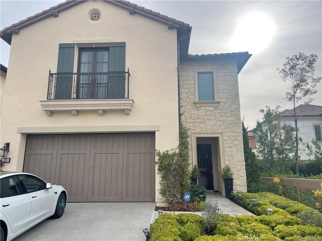 120 Statura Irvine, CA 92602 - Photo 26 of 27 a front view of a house with garden