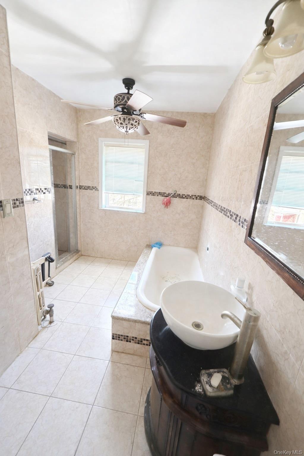 179-15 Selover Road Queens, NY 11434 - Photo 11 of 16 a bathroom with a sink toilet and shower