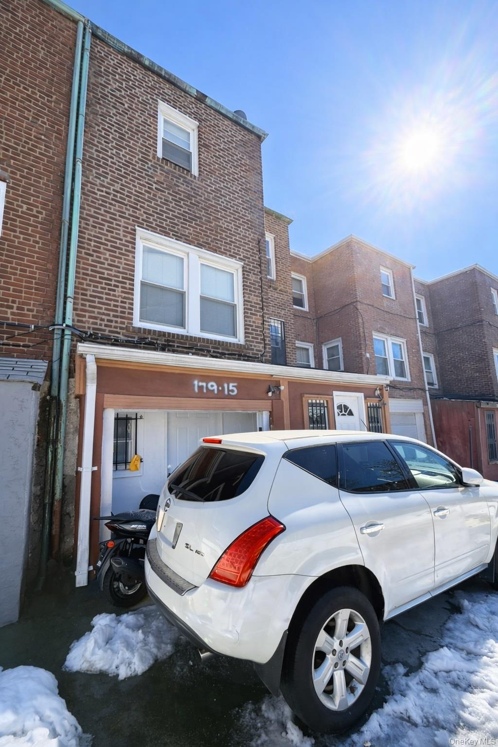 179-15 Selover Road Queens, NY 11434 - Photo 16 of 16 a table and chairs in front of a house