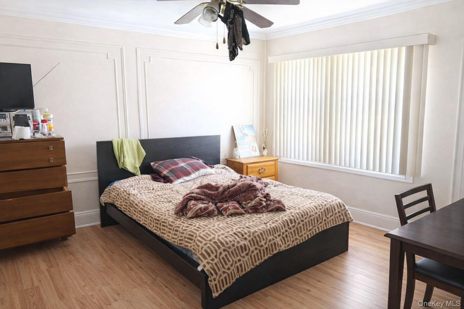 179-15 Selover Road Queens, NY 11434 - Photo 7 of 16 a bedroom with a bed and wooden floor