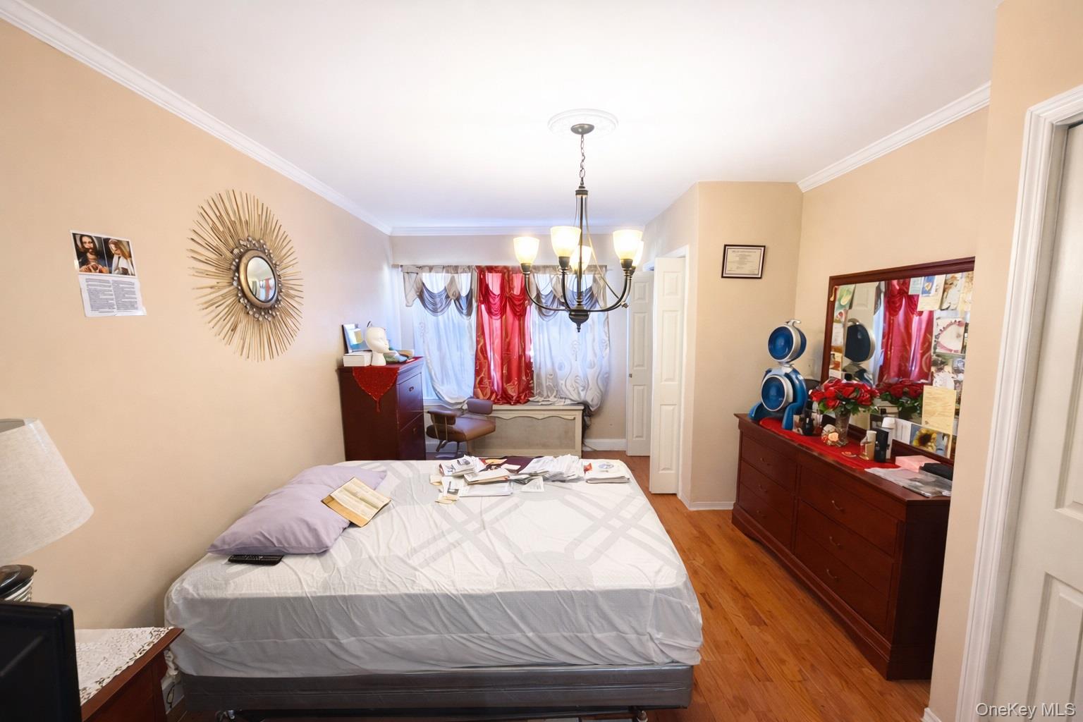 179-15 Selover Road Queens, NY 11434 - Photo 8 of 16 a bed room with a bed mirror and a closet