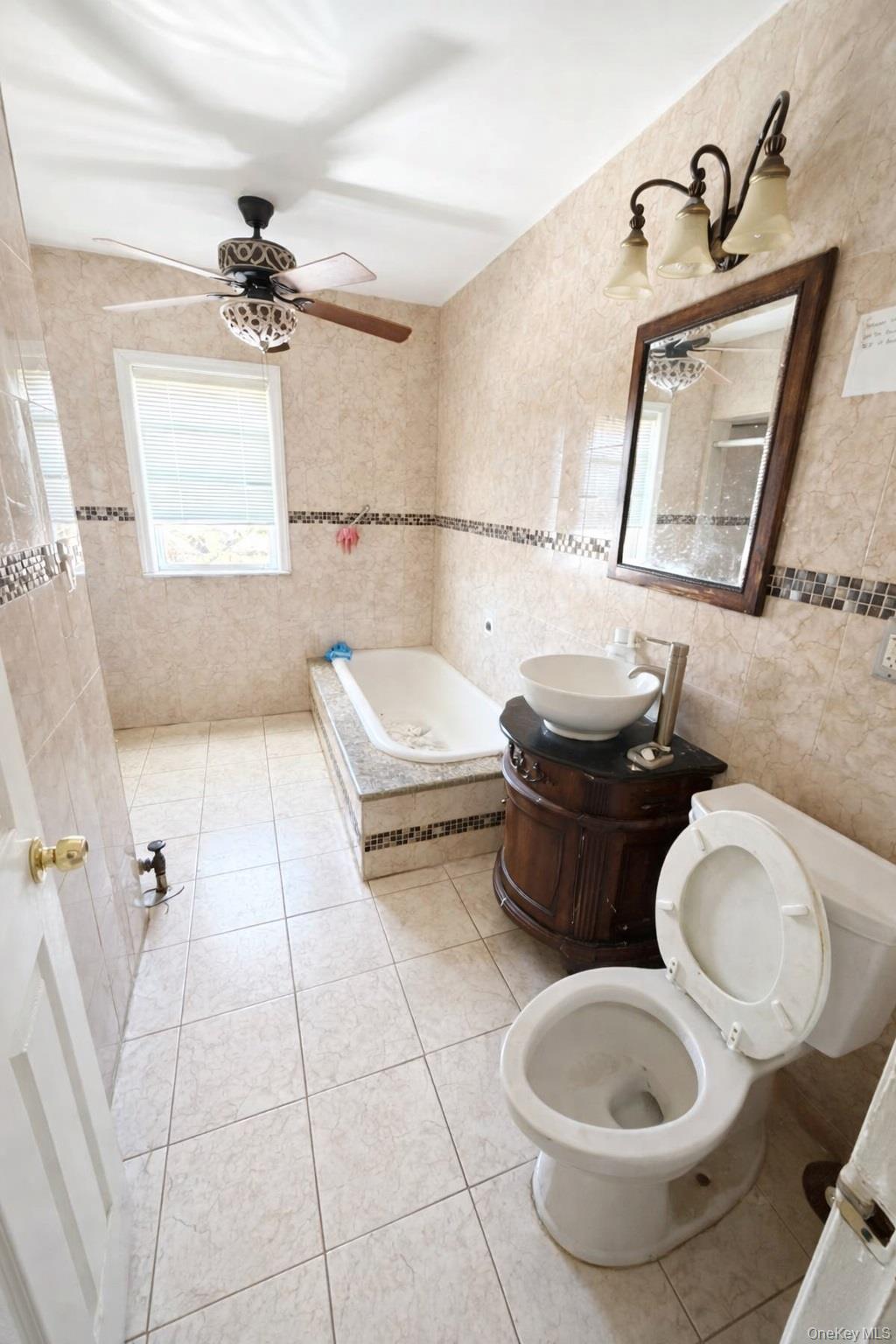 179-15 Selover Road Queens, NY 11434 - Photo 9 of 16 a bathroom with a toilet sink and mirror