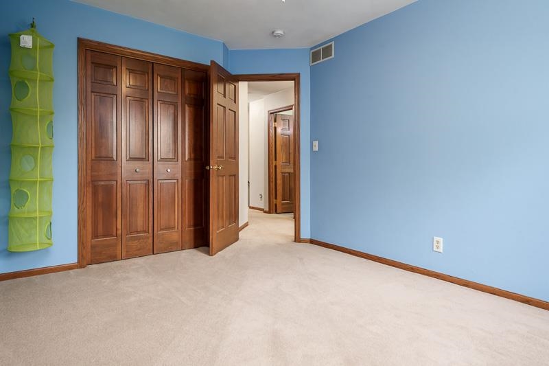 8833 West Ridge Drive Belvidere, IL 61008 - Photo 56 of 65 a view of an empty room with closet and a window