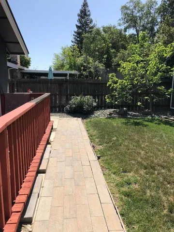 a backyard of a house with lots of green space