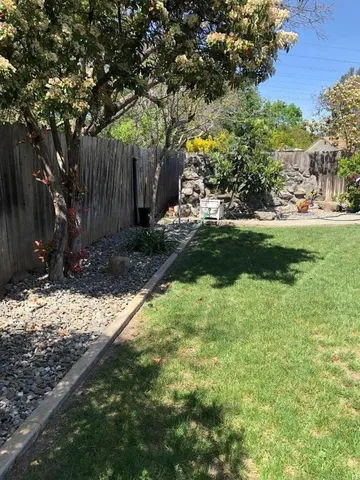 a backyard of a house with lots of green space