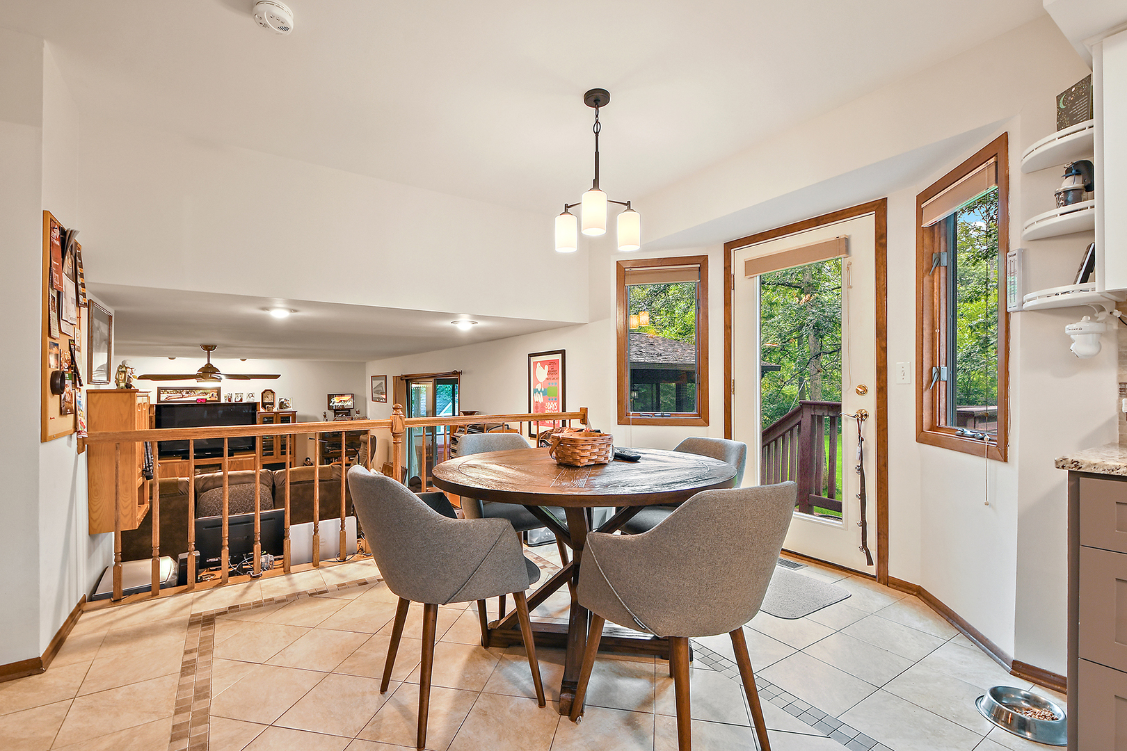 12612 West Hadley Road Homer Glen, IL 60491 - Photo 11 of 39 a dining room with furniture a chandelier and wooden floor