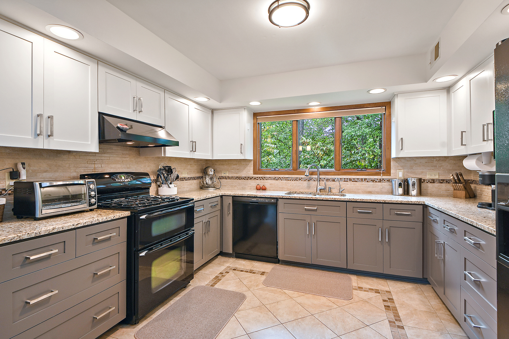 12612 West Hadley Road Homer Glen, IL 60491 - Photo 12 of 39 a kitchen with stainless steel appliances granite countertop a stove sink and cabinets