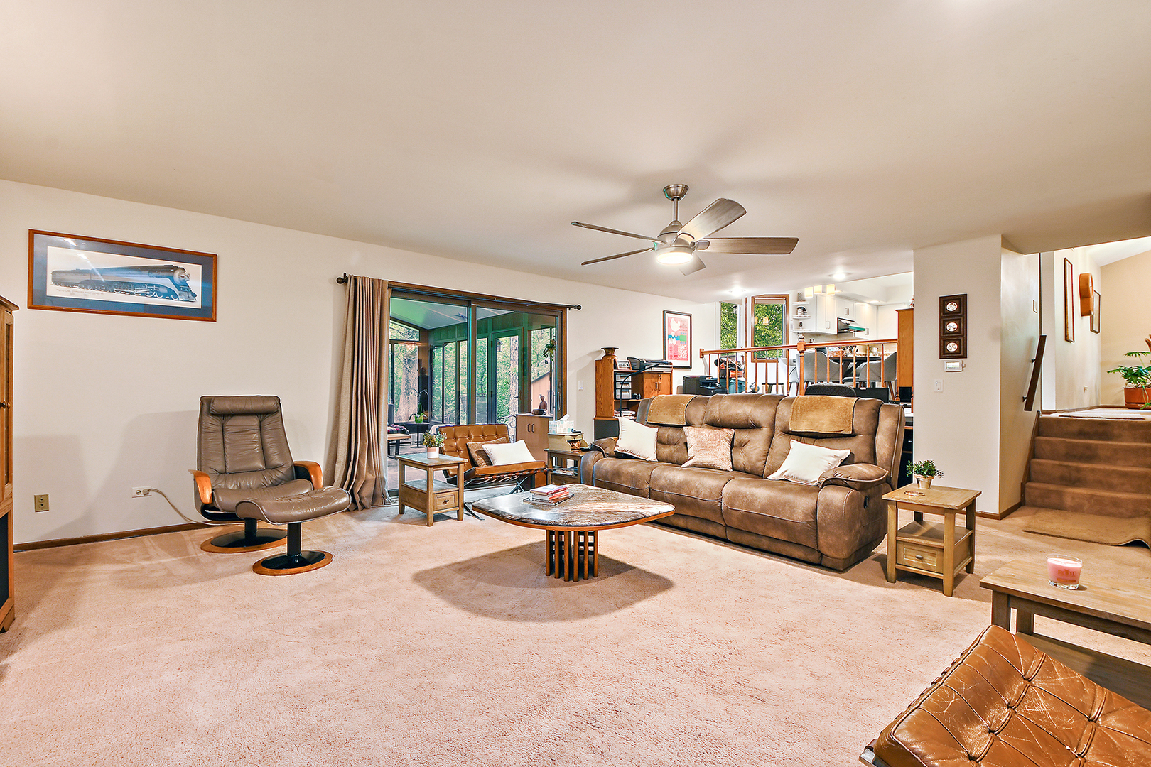12612 West Hadley Road Homer Glen, IL 60491 - Photo 13 of 39 a living room with furniture gym equipment and a large window