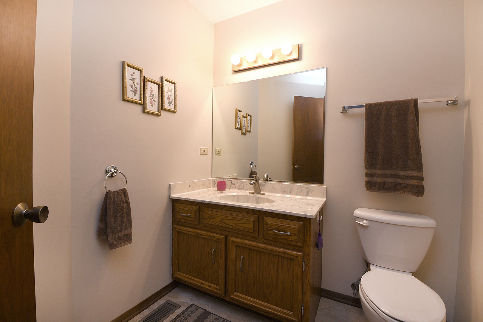 12612 West Hadley Road Homer Glen, IL 60491 - Photo 17 of 39 a bathroom with a toilet sink and mirror