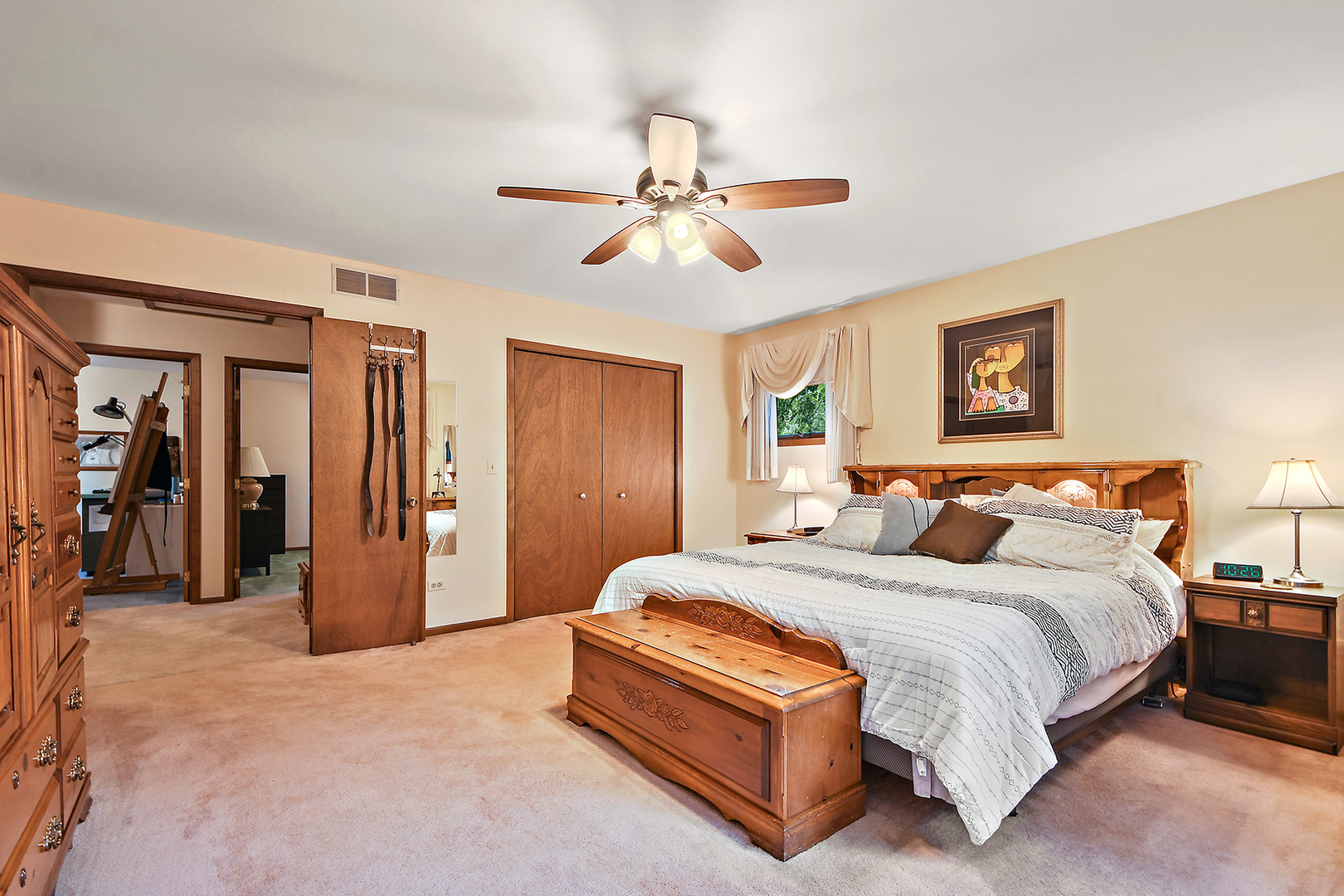 12612 West Hadley Road Homer Glen, IL 60491 - Photo 19 of 39 a spacious bedroom with a bed and ceiling fan