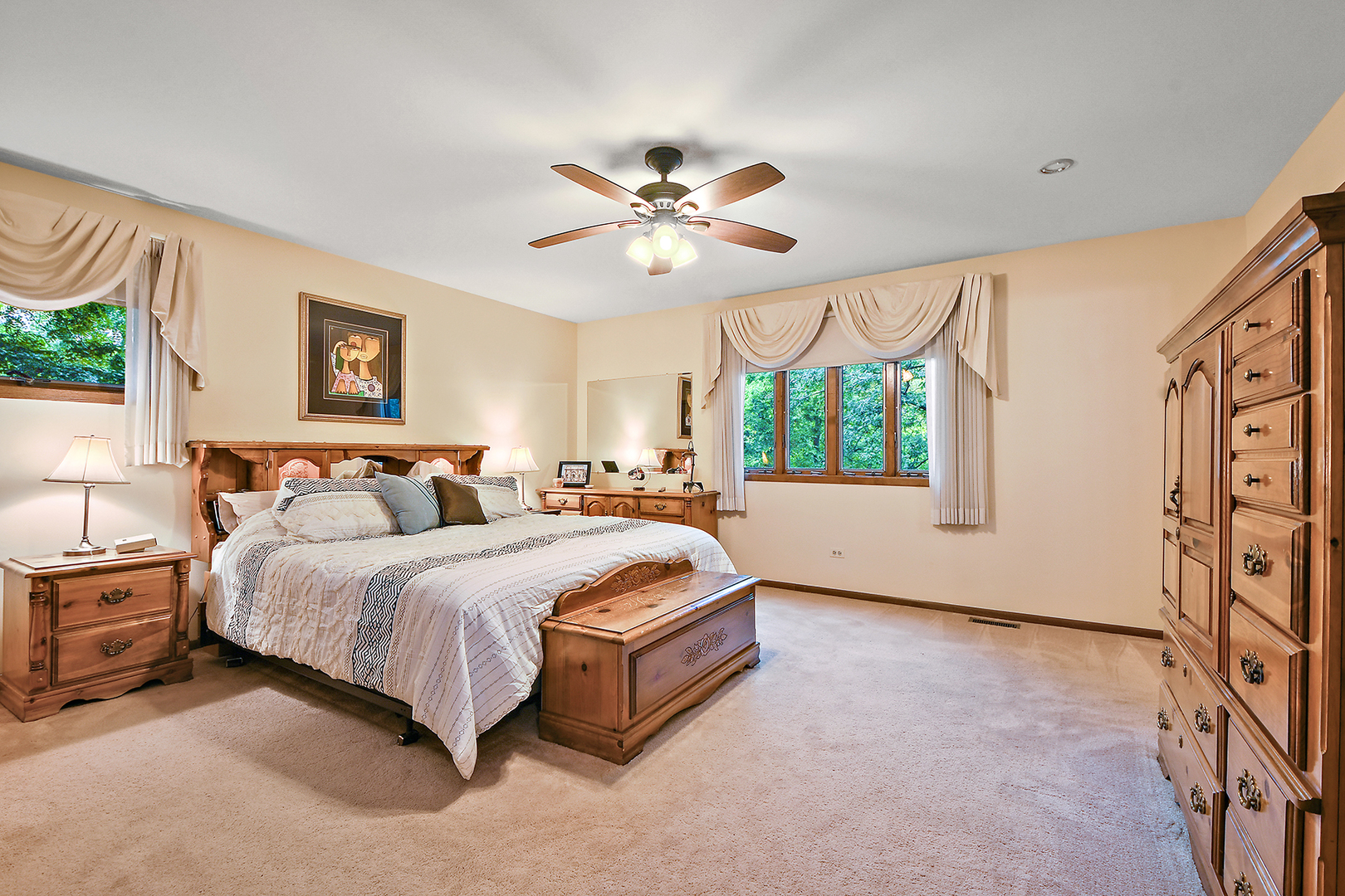 12612 West Hadley Road Homer Glen, IL 60491 - Photo 20 of 39 a spacious bedroom with a bed and a large window