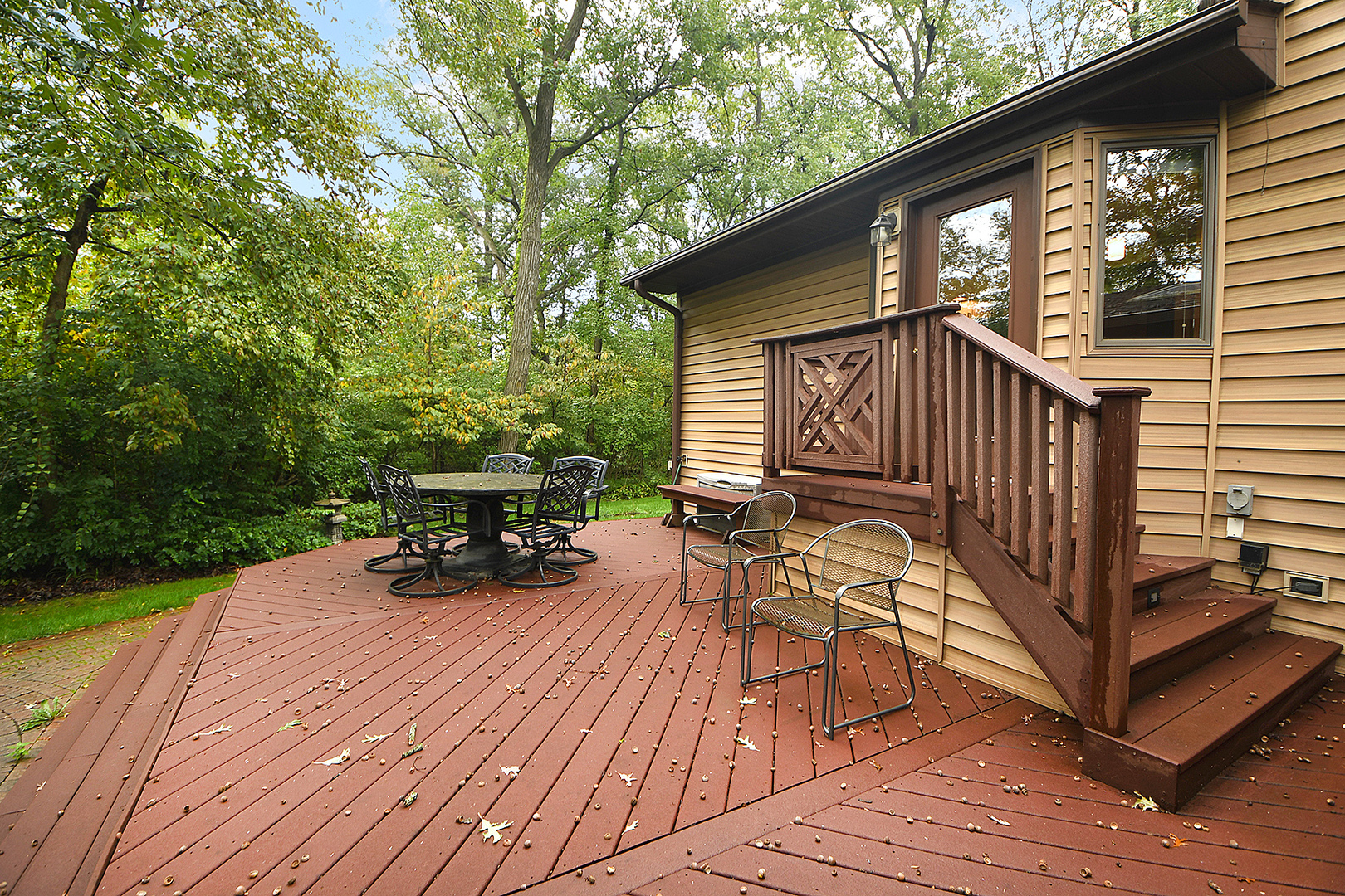 12612 West Hadley Road Homer Glen, IL 60491 - Photo 28 of 39 a view of a deck with table and chairs with wooden floor and fence