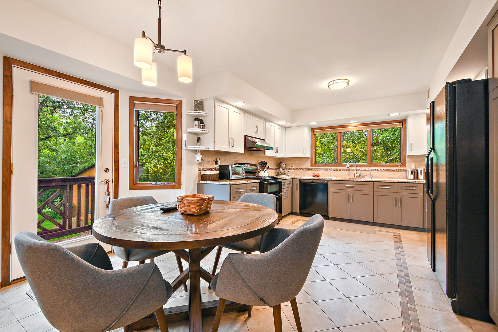 12612 West Hadley Road Homer Glen, IL 60491 - Photo 10 of 39 a kitchen with a dining table chairs and refrigerator
