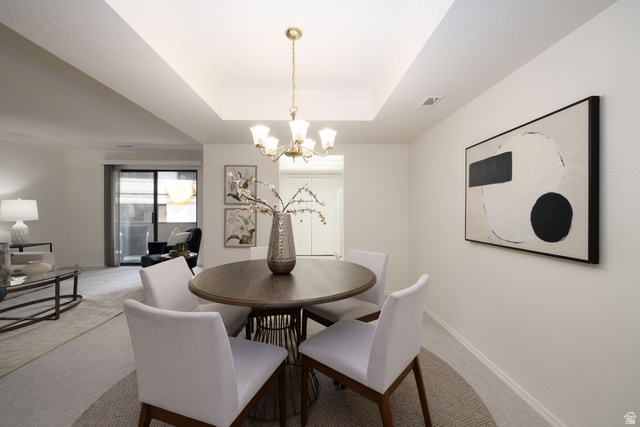6936 South 775 East, Unit B Midvale, UT 84047 - Photo 7 of 33 Dining room with a raised ceiling, carpet, and suspended lighting