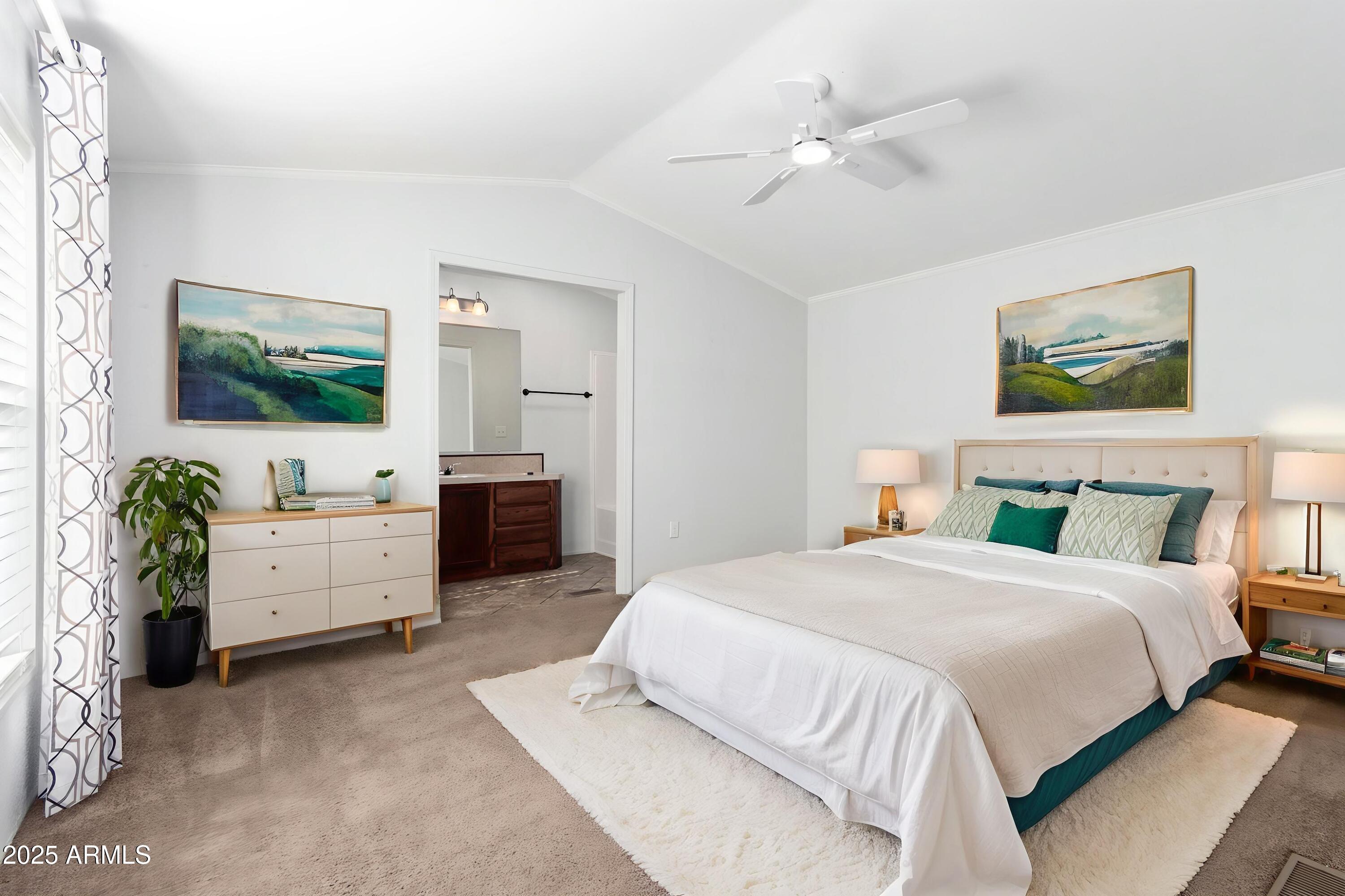 320 East McKellips Road, Unit 230 Mesa, AZ 85201 - Photo 12 of 43 a spacious bedroom with a bed and a flat screen tv