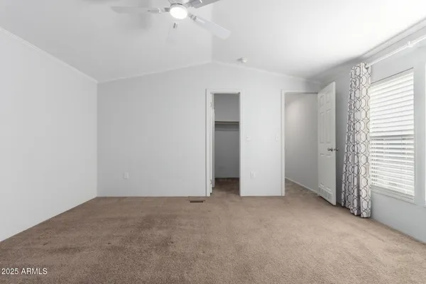 a view of an empty room with a window