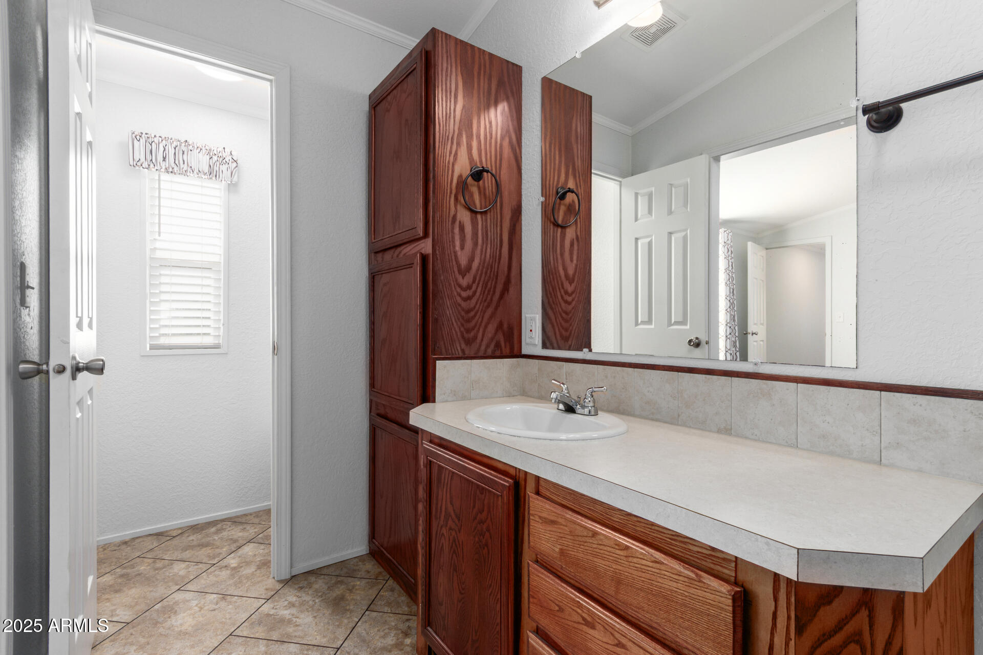 320 East McKellips Road, Unit 230 Mesa, AZ 85201 - Photo 16 of 43 a bathroom with a sink and a mirror