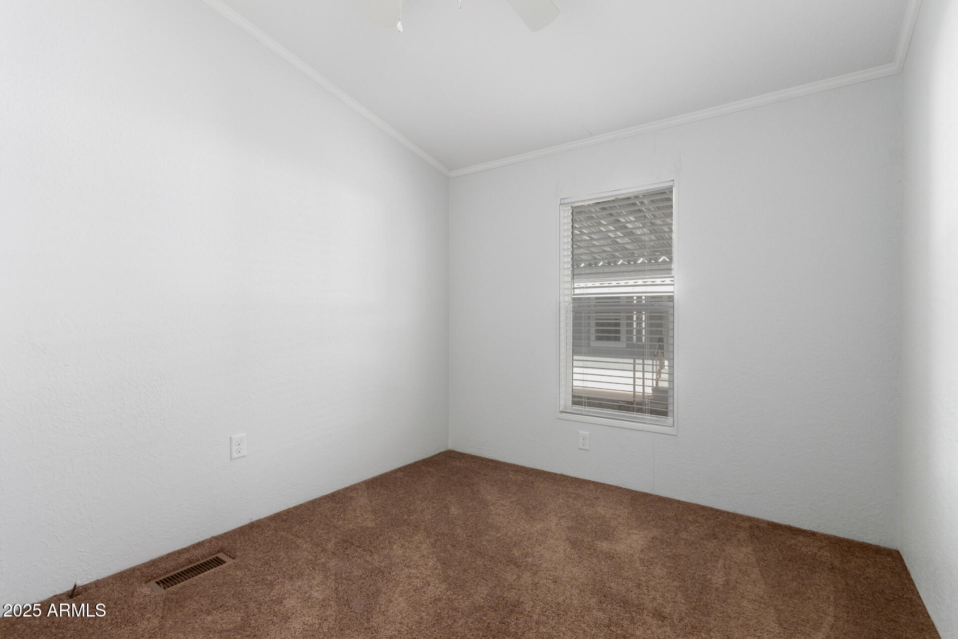 320 East McKellips Road, Unit 230 Mesa, AZ 85201 - Photo 20 of 43 a view of an empty room with a window
