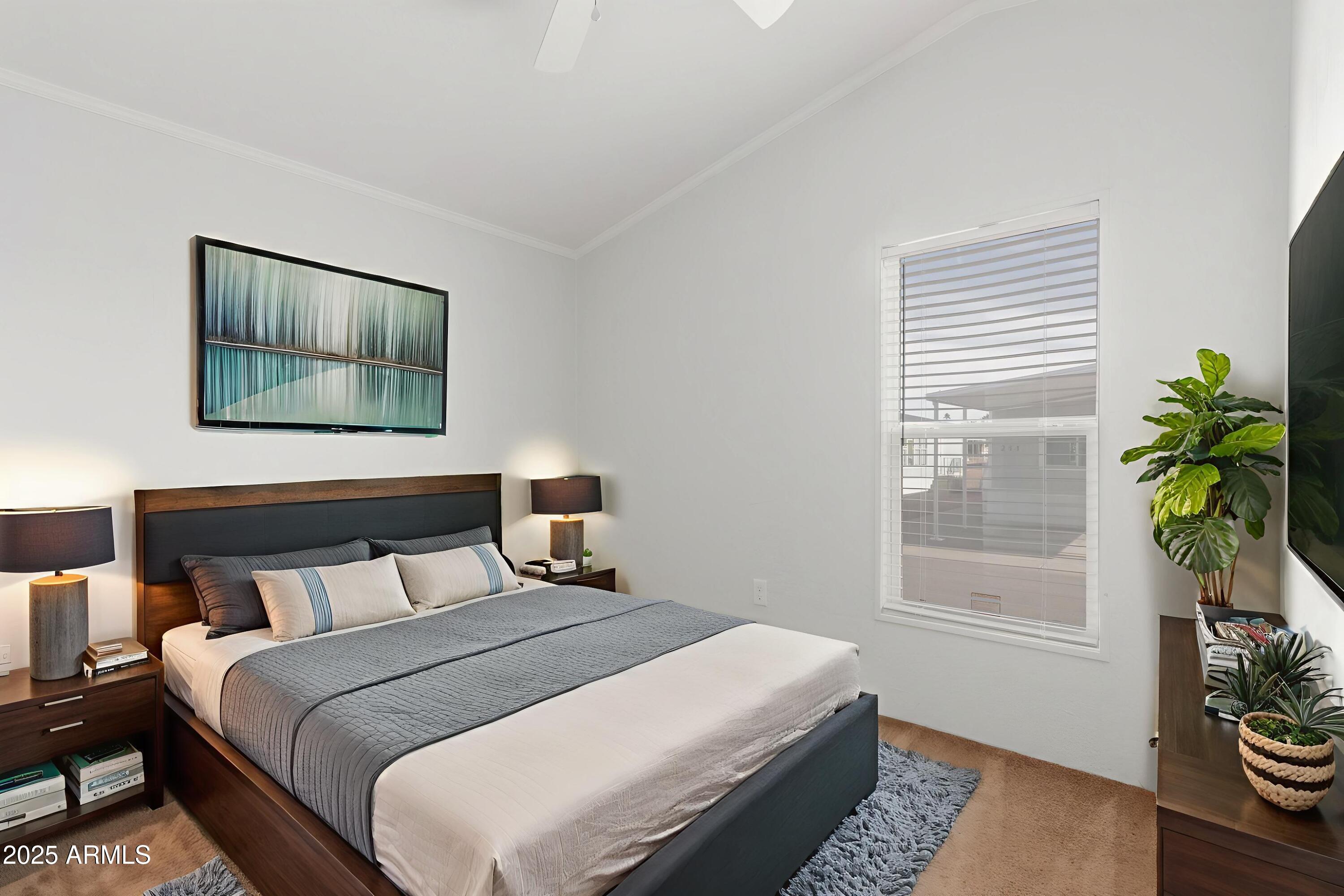 320 East McKellips Road, Unit 230 Mesa, AZ 85201 - Photo 23 of 43 a bedroom with a bed and a window