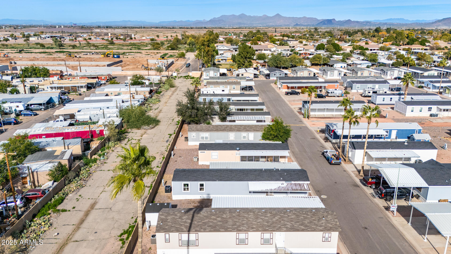 320 East McKellips Road, Unit 230 Mesa, AZ 85201 - Photo 31 of 43 an aerial view of residential houses with outdoor space