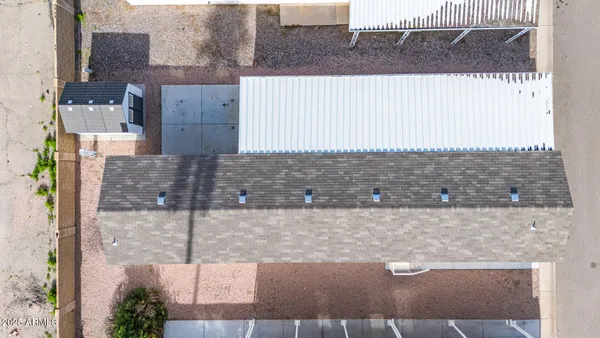 an aerial view of residential houses with outdoor space
