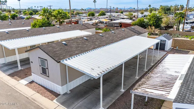 an aerial view of a house with sitting area