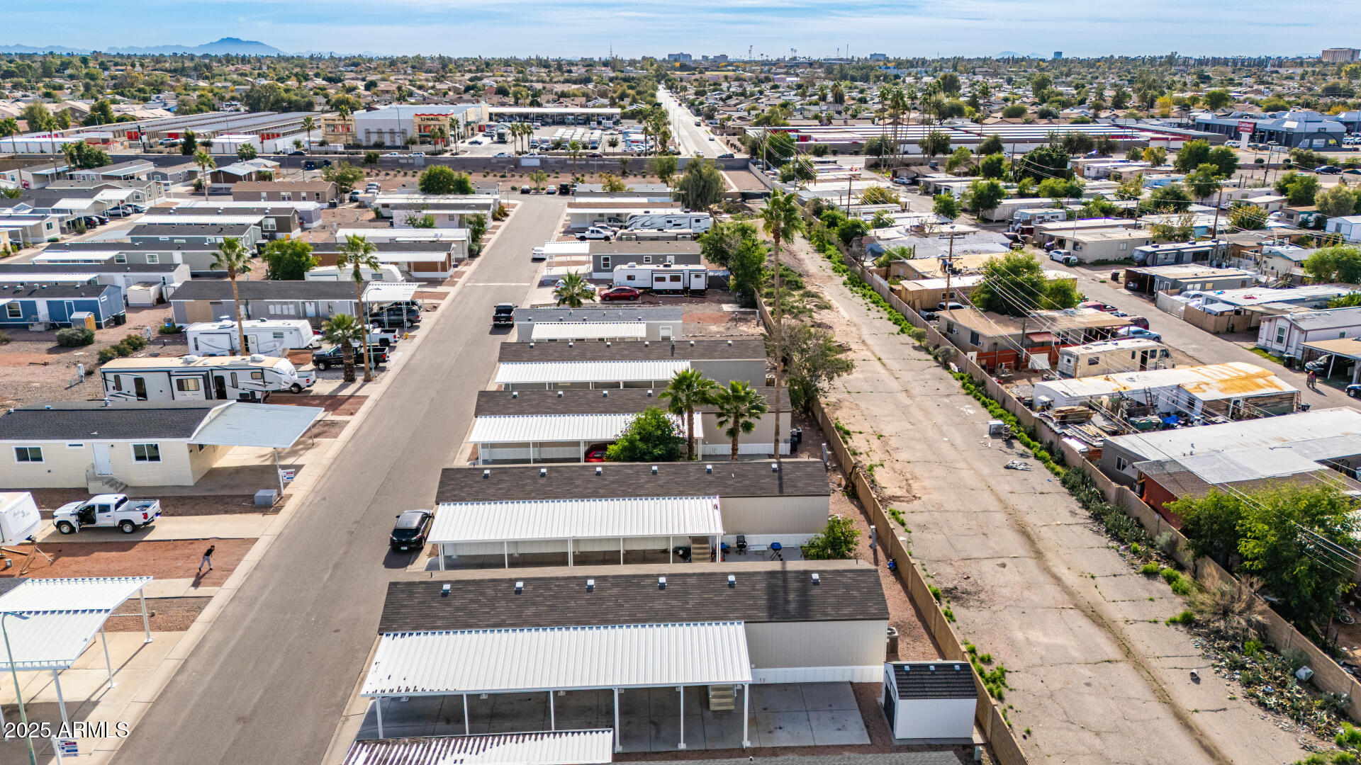 320 East McKellips Road, Unit 230 Mesa, AZ 85201 - Photo 38 of 43 an aerial view of a city with lots of residential buildings