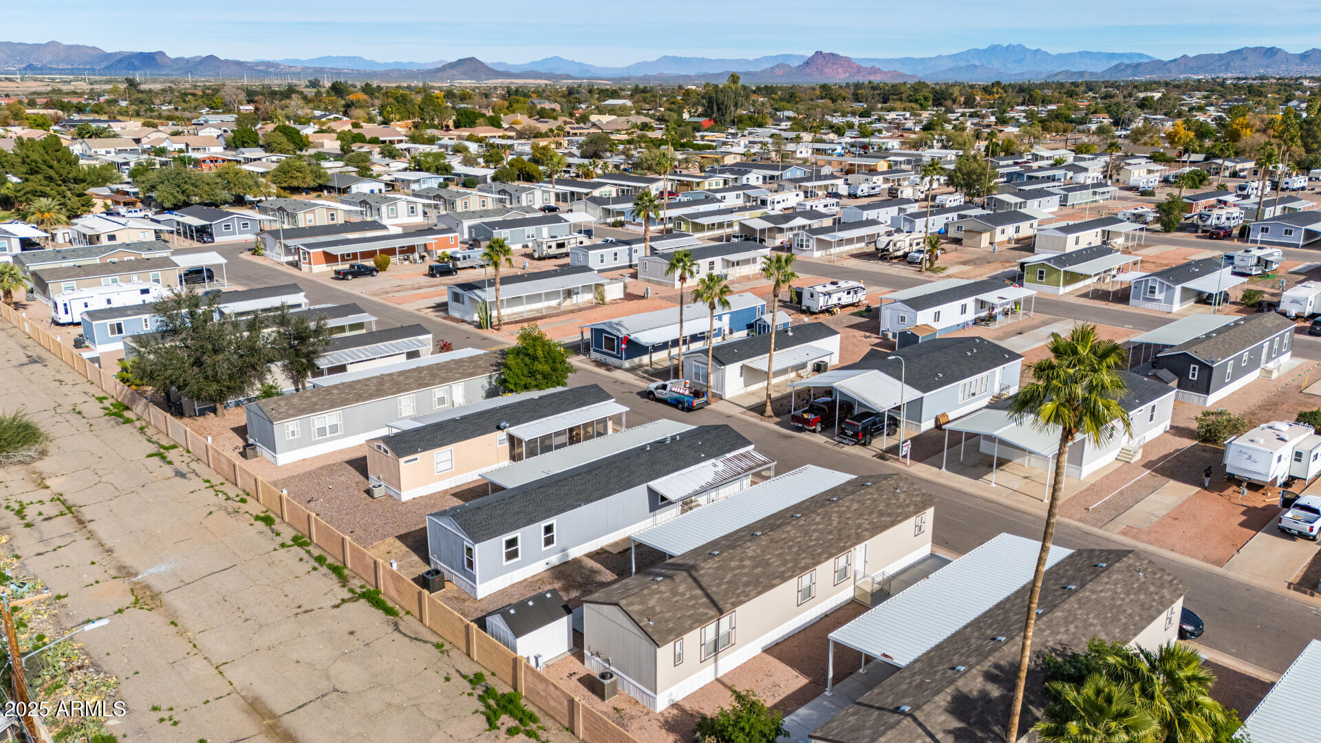 320 East McKellips Road, Unit 230 Mesa, AZ 85201 - Photo 40 of 43 an aerial view of a city with lots of residential buildings
