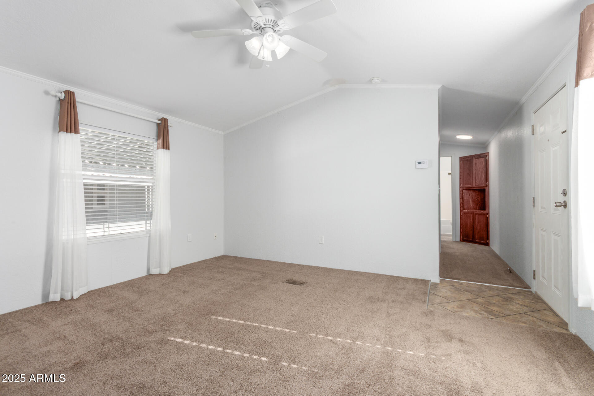 320 East McKellips Road, Unit 230 Mesa, AZ 85201 - Photo 6 of 43 a view of an empty room with a window