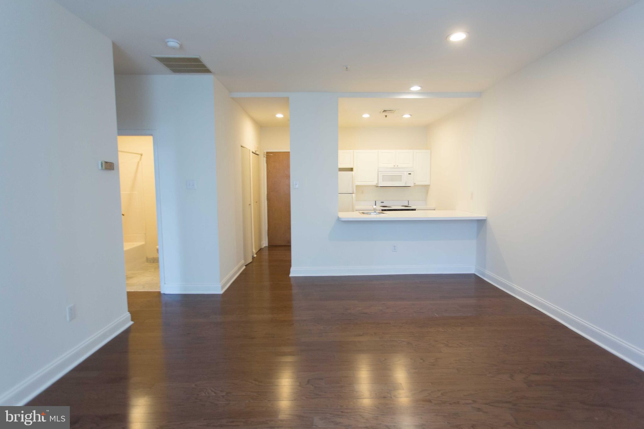 1600-2 Walnut Street, Unit 405 Philadelphia, PA 19103 - Photo 14 of 22 a view of a hallway with wooden floor