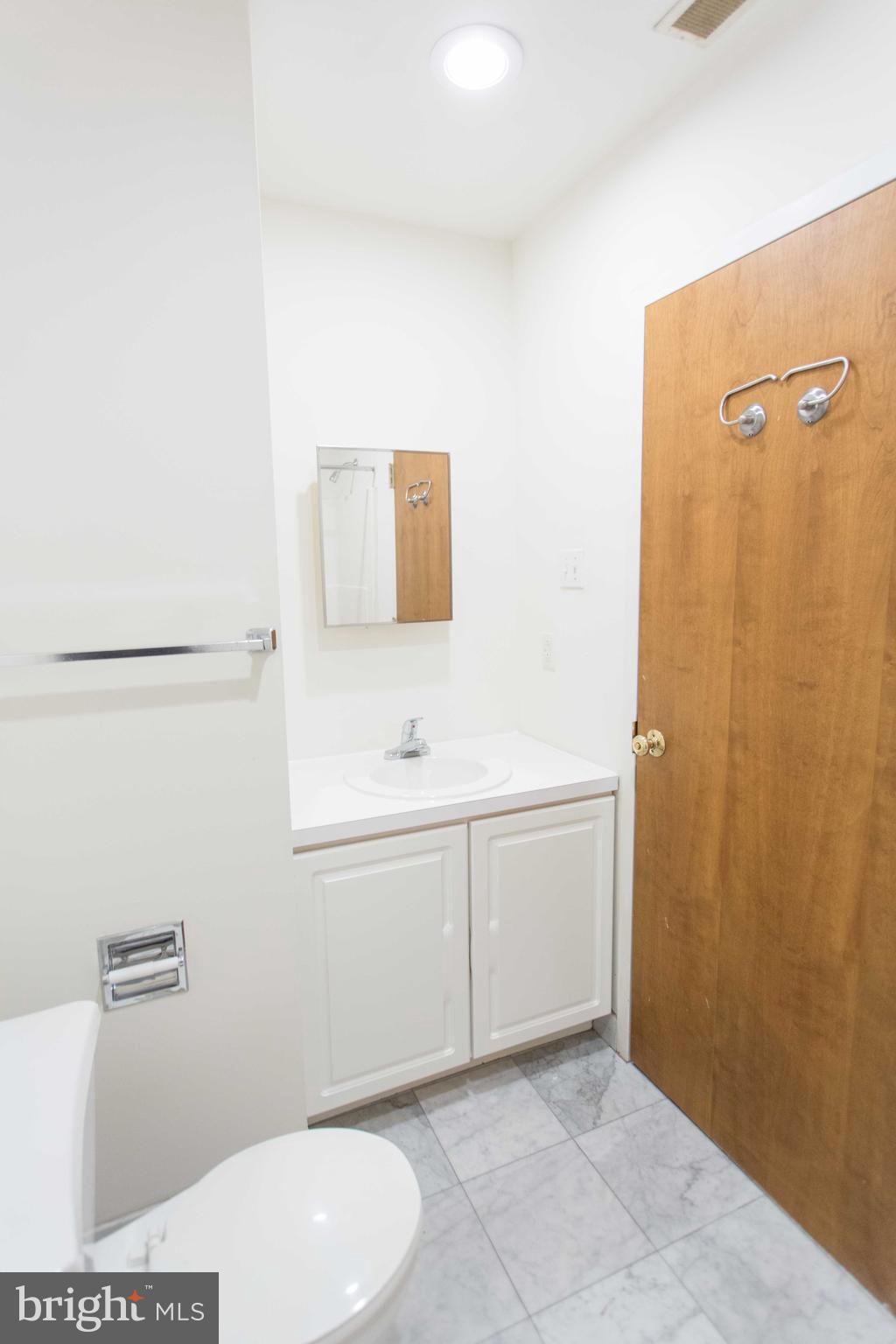 1600-2 Walnut Street, Unit 405 Philadelphia, PA 19103 - Photo 17 of 22 a bathroom with a sink a toilet and shower
